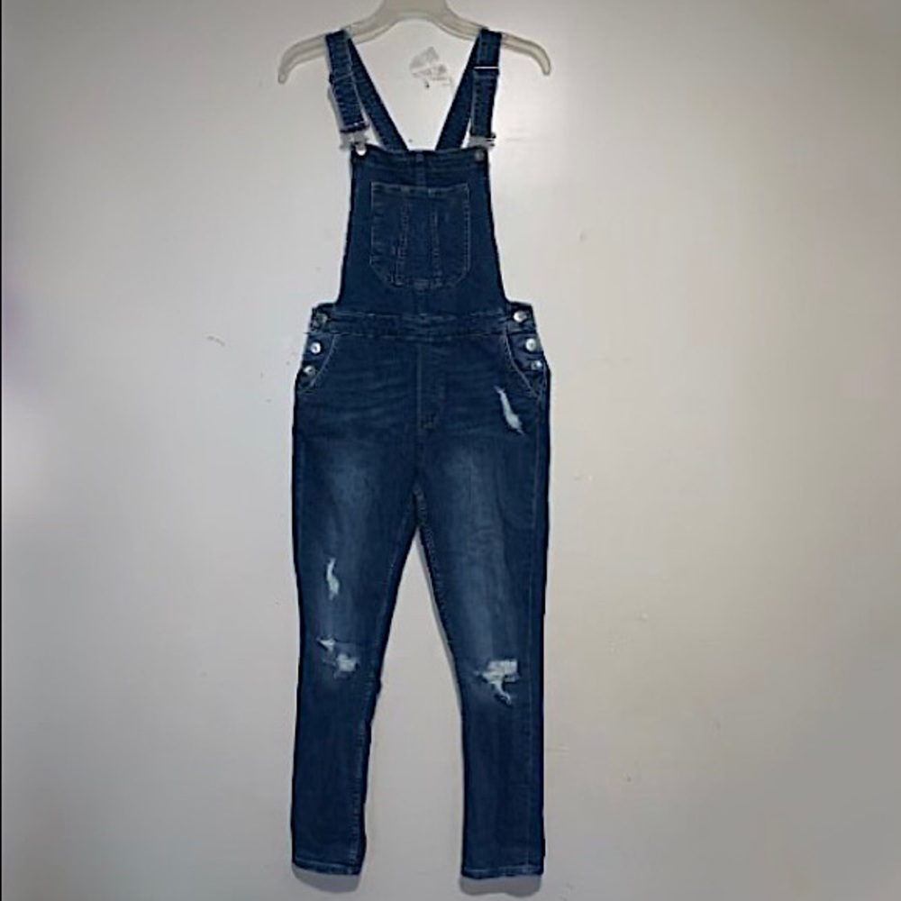 Distressed denim overalls.
